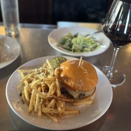 The Rossi Kitchen and Bar signature dishes Truffle PizzaThe Rossi BurgerBo Ssam